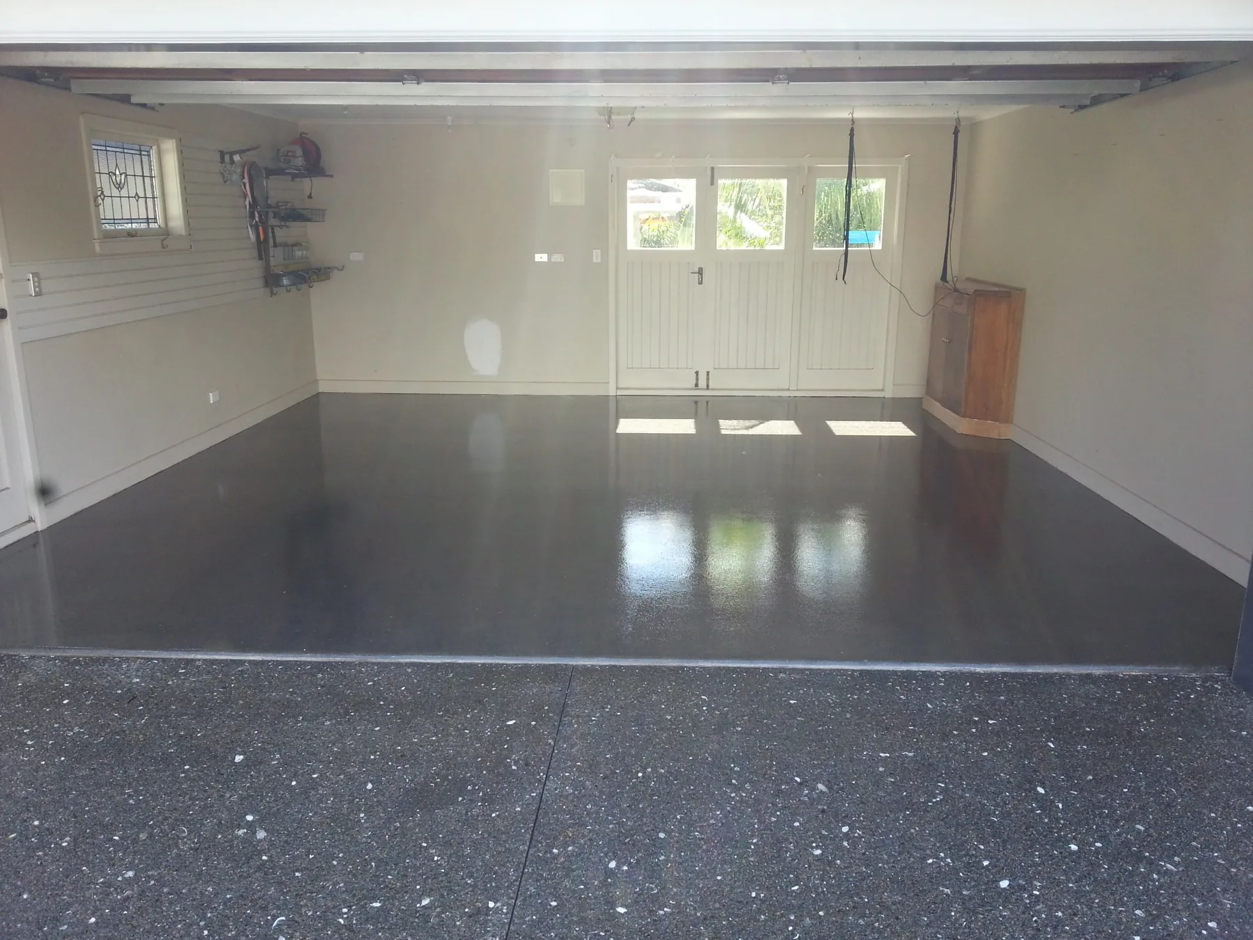 Clear polyaspartic coated concrete floor in Takapuna